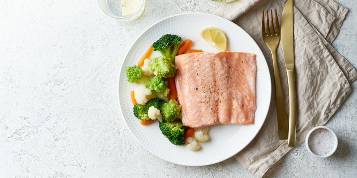 Steam salmon and vegetables, Paleo, keto, fodmap, dash diet. Mediterranean diet with steamed fish. Healthy concept, gluten free, lectine free, top view, copy space. Long banner,