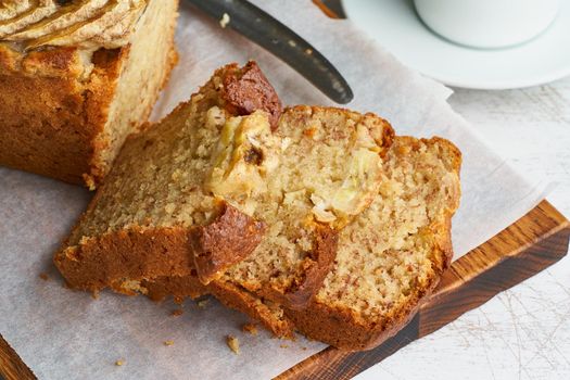 Banana bread. Cake with banana, traditional american cuisine. Slice of loaf. Top view, close up.