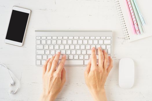 Work from home, online learning. Female desk. Top view. Distance education. Woman hands typing on laptop. Freelancer, Digital nomad concept