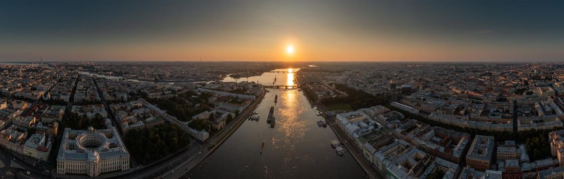 Aerial panoramic landscape of warships in the waters of the Neva River before the holiday of the Russian Navy, sea power, the latest cruisers among the sights, Isaac cathedral on a background. High quality photo