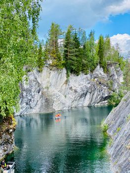 Vertical view of wild woods and idyllic lake in calm. North nature, taiga. Korela Russia. Marble canyon