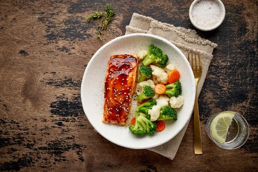 Steam salmon and vegetables, Paleo, keto, fodmap, dash diet. Mediterranean food with steamed fish. Oven baked asian dish with teriyaki. Healthy concept, gluten free, lectine free, top view