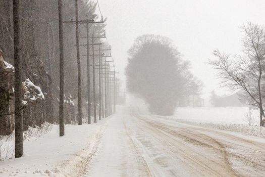 Snow Squall Conditions on a Rural Country Road in Ontario Canada. High quality photo