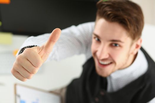 Top view of male showing thumbs up sign with hand, cheerful office worker. Successful employee in suit smile on camera. Support, confirm, good job concept