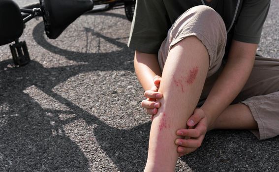 A Boy with wounds in bike crash