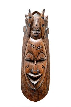Traditional wooden figurine from Africa isolated on white background. Carving handicraft face statuette
