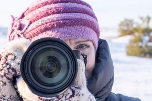 portrait of a photographer with a camera on his face. High quality photo