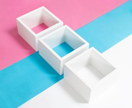 Simply design with empty blue frame isolated on pink and blue pastel colorful background. Top view, flat lay, copy space, mock up.