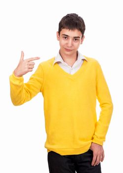 schoolboy in yellow sweater points at himself with hand isolated on white background