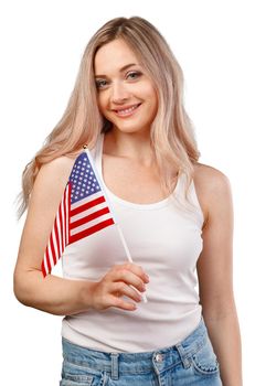 Portrait of a young smiling woman holding USA flag isolated on white background