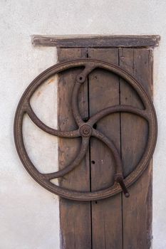 medieval manual crank on wooden door. High quality photo