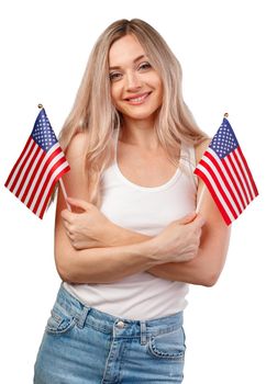 Portrait of a young smiling woman holding USA flag isolated on white background