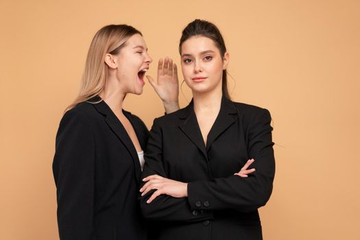 Boss yelling at employee. Colleague screaming on worker. Bulling on work. One woman smile looking camera arms crossed another woman shouting on her loud. Stress resistance concept