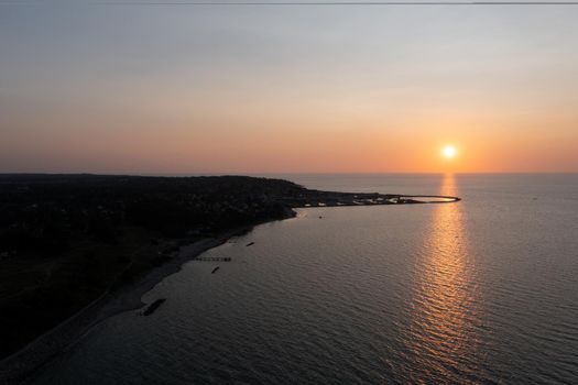 Gilleleje, Denmark - July 23, 2021: Aerial drone view of the silhouette of the local fishing harbour