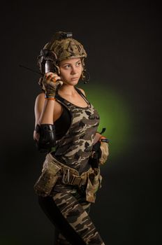 girl in a military uniform helmet says on the radio