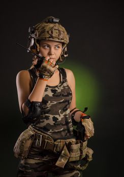 girl in a military uniform helmet says on the radio