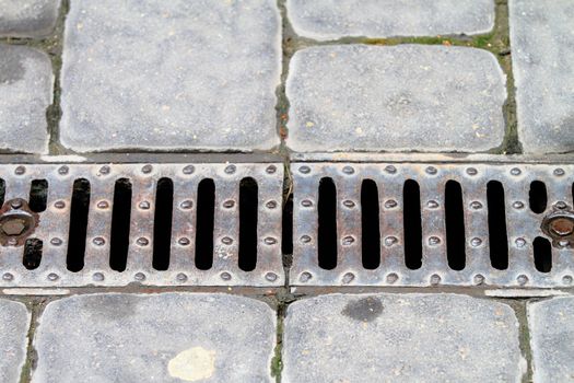 sewer closeup photo, iron made, horizontal composition