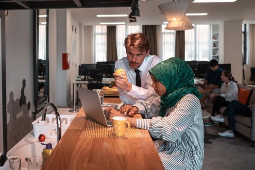 International multicultural business team. A young businessman and businesswoman sit in a modern relaxation space and talk about a new business. High-quality photo