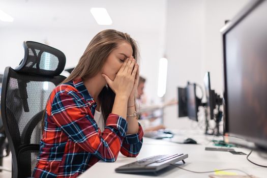 Beautiful Shocked and Annoyed Young Woman Looking at her desktop. Sad Operator Agent Woman Working from Home in a Call Center. High-quality photo