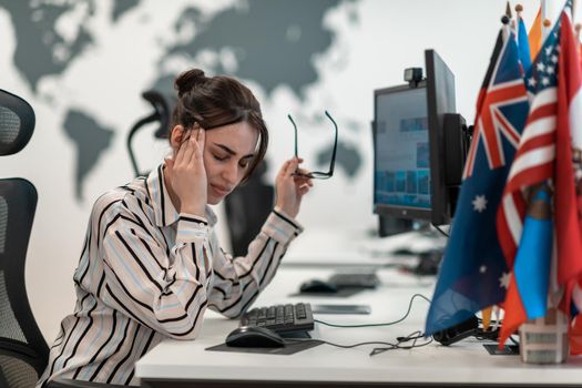 Beautiful Shocked and Annoyed Young Woman Looking at her Laptop. Sad Operator Agent Woman Working from Home in a Call Center. High-quality photo