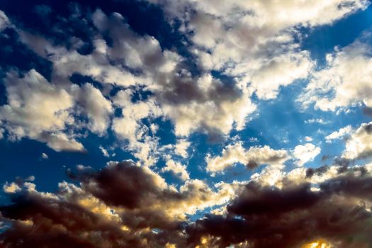 Panoramic view of the blue sky with clouds in motion. View of the blue sky with clouds in motion.Nice weather with clear skies.Heavenly Light.Dramatic sky with clouds