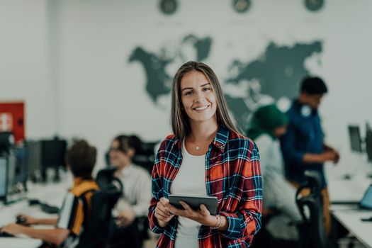 Portrait of businesswoman in casual clothes holding tablet computer at modern startup open plan office interior. Selective focus. High-quality photo