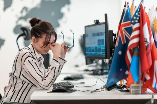 Beautiful Shocked and Annoyed Young Woman Looking at her Laptop. Sad Operator Agent Woman Working from Home in a Call Center. High-quality photo