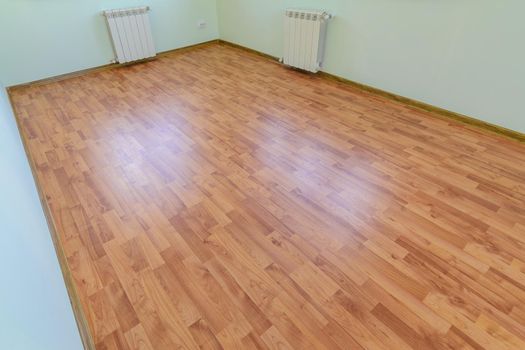 Laminate on the floor of the room after renovation in the apartment a