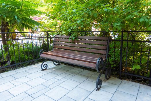 Beautiful forged bench in a well-maintained place a