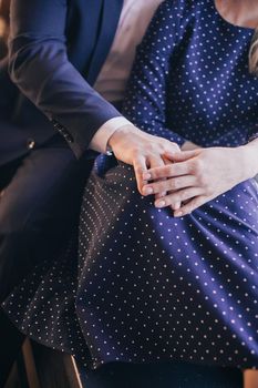 Closeup of loving couple holding hands. High quality photo