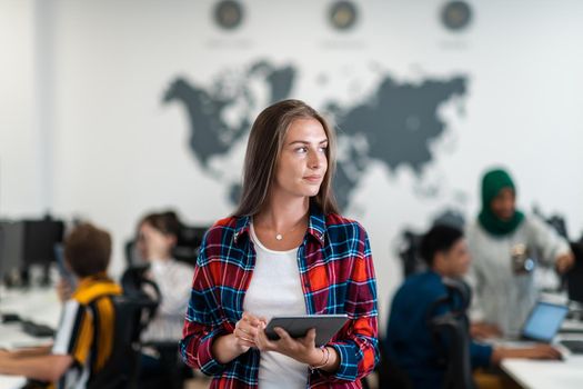 Portrait of businesswoman in casual clothes holding tablet computer at modern startup open plan office interior. Selective focus. High-quality photo