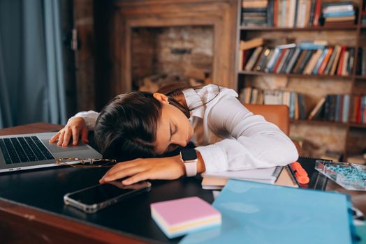 Tired woman sleeping at workplace at Lunch break