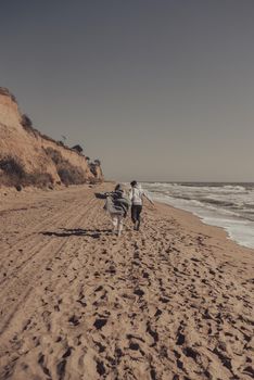 A man and a woman enjoy each other on the seashore. Have fun together
