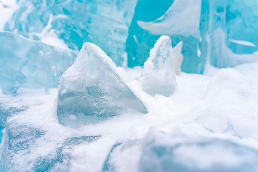 The blue ice of Lake Baikal. Baikal in winter. Transparent and clean ice of Lake Baikal.