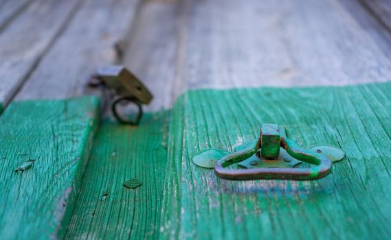 Closeup of vintage doorknocker, wooden door, shallow depth of field