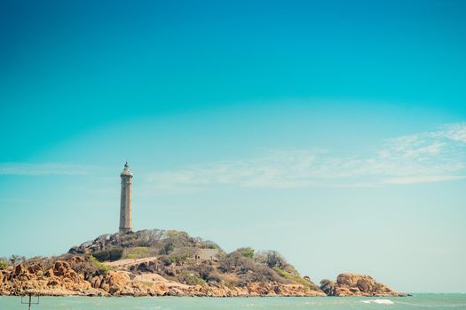 Sea nature panoramic view landscape background. Ocean rocky cliffs forested island. Clear blue sky. Lighthouse on mountain top. Signal warn sailors shipwreck, travel concept hope purpose of life.