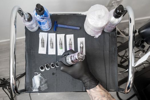Close up of tattoo artist tools and workplace. High quality photo.