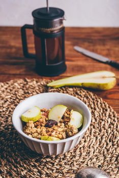 Bowl of Granola with Pear and Raisins for Breakfast