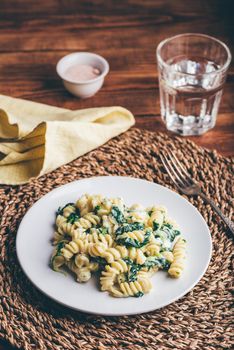 Creamy Pasta with Spinach and Thyme on White Plate