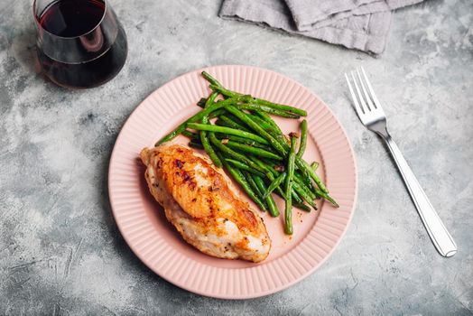 Oven-baked Chicken Breasts and Green Beans Fried with Garlic and Thyme