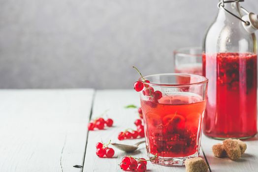 Infused water with fresh red currant and cane sugar