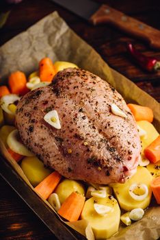 Seasoned chicken breast ready for roast in oven