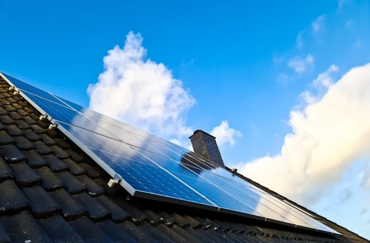 Solar panels producing clean energy on a roof of a residential house