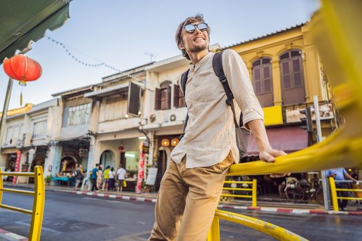 Man tourist on the Street in the Portugese style Romani in Phuket Town. Also called Chinatown or the old town.