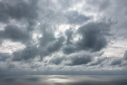 Wide angle view of cloudy sky over sea and horizon