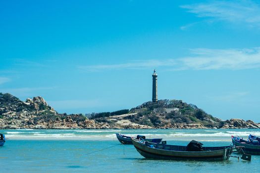 Sea nature panoramic view landscape background. Ocean rocky cliffs forested island. Clear blue sky. Lighthouse on mountain top. Signal warn sailors ship wreck, travel concept hope purpose of life.