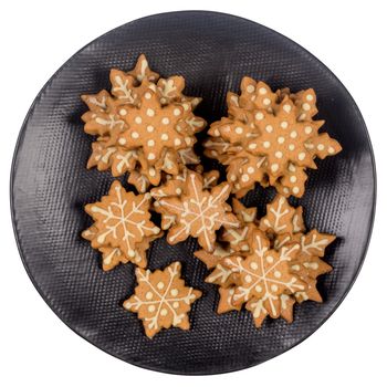 Plate with tasty Christmas cookies on white background.
