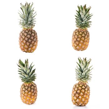 Fresh ripe pineapples isolated on white white background.