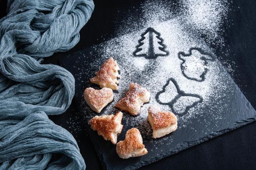 Homemade various christmas gingerbread cookies. Christmas baking black background