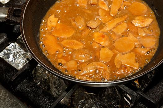 Preparing boletus mushrooms in the pan with sauce